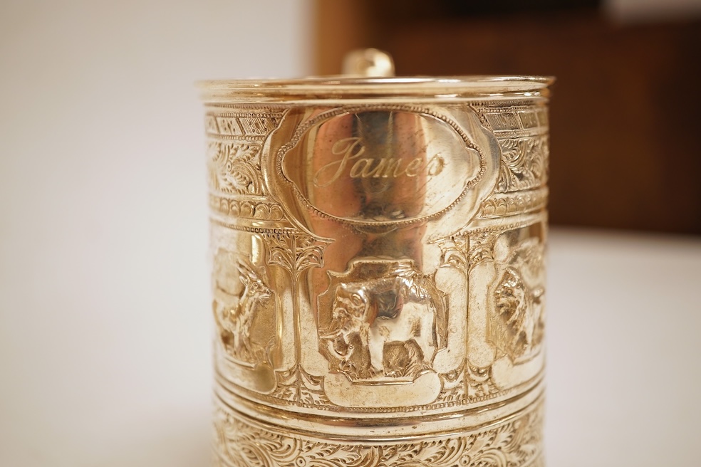 A George III silver baluster mug, Peter & Ann Bateman?, London, 1797, height 10.6cm, together with a late Victorian embossed silver christening mug, Glasgow, 1893, 12.2oz.